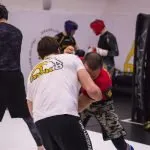 man in white t-shirt and black pants