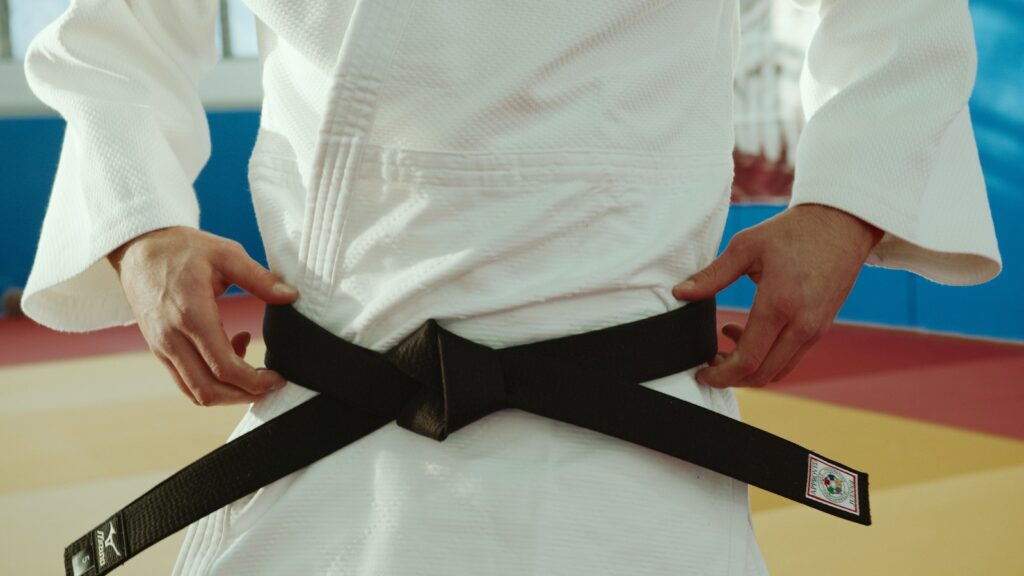 Close-Up Shot of a Person Wearing a Black Belt